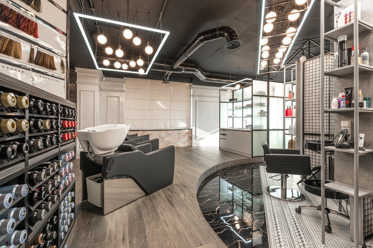 Stylish and spacious hair salon interior with contemporary design elements.